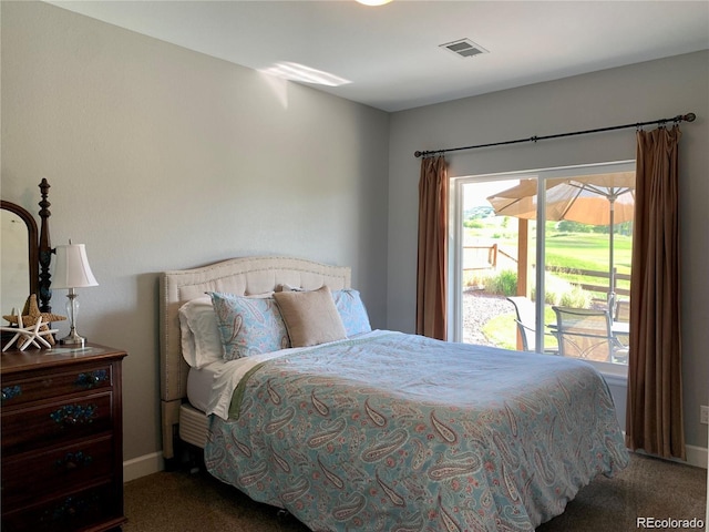 bedroom with carpet and access to outside