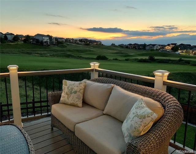 view of balcony at dusk