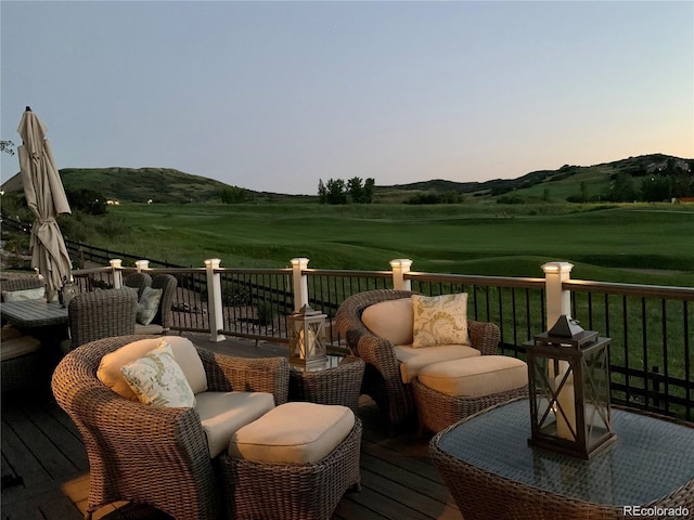 deck at dusk with a mountain view