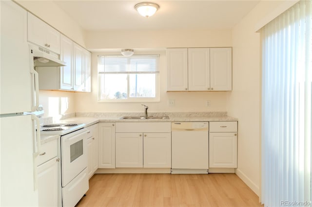 kitchen with sink, white appliances, white cabinets, and light wood-type flooring