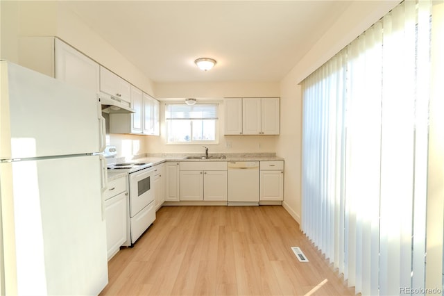 kitchen featuring white cabinetry, sink, white appliances, and light hardwood / wood-style flooring