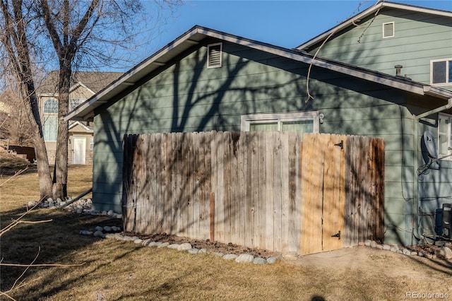 view of side of property featuring a yard