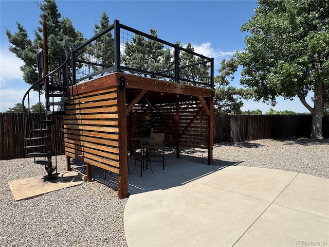 2493 S Kalispell Cir, Aurora, CO 80013 - fenced backyard with stairway, a patio, and a deck