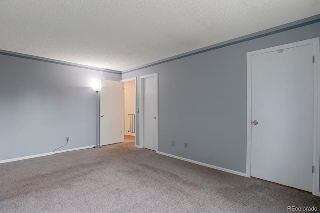 2493 S Kalispell Cir, Aurora, CO 80013 - carpeted spare room with a textured ceiling and baseboards