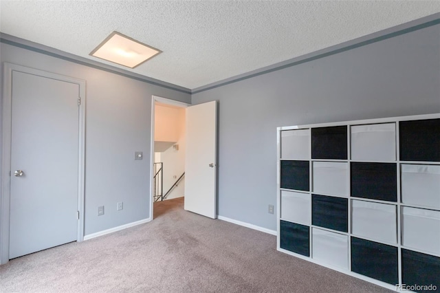 2493 S Kalispell Cir, Aurora, CO 80013 - unfurnished bedroom with a textured ceiling and carpet floors