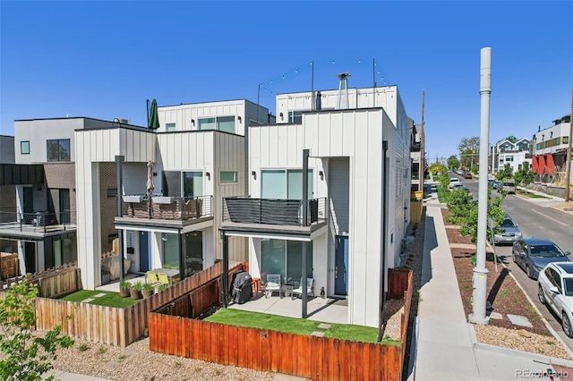 1299 Newton St, Denver, CO 80204 - view of property with a fenced front yard and a residential view