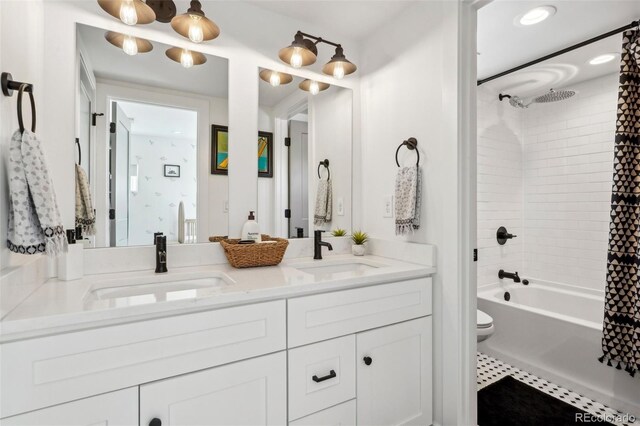 1299 Newton St, Denver, CO 80204 - full bathroom with double vanity, shower / tub combo, toilet, and tile patterned floors