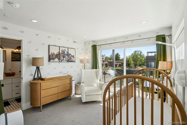 1299 Newton St, Denver, CO 80204 - bedroom featuring wallpapered walls, light carpet, recessed lighting, and access to exterior