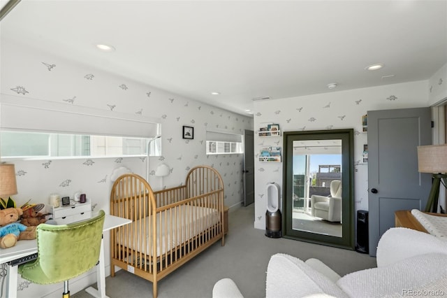 1299 Newton St, Denver, CO 80204 - bedroom with wallpapered walls, carpet flooring, access to exterior, and recessed lighting