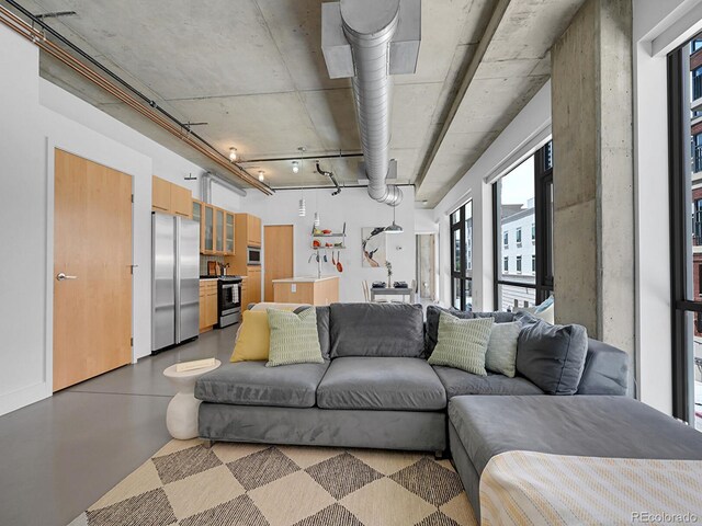 living room with concrete floors