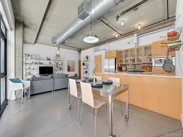dining room with concrete floors