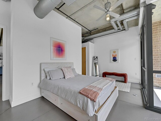 bedroom with finished concrete flooring, baseboards, and ceiling fan