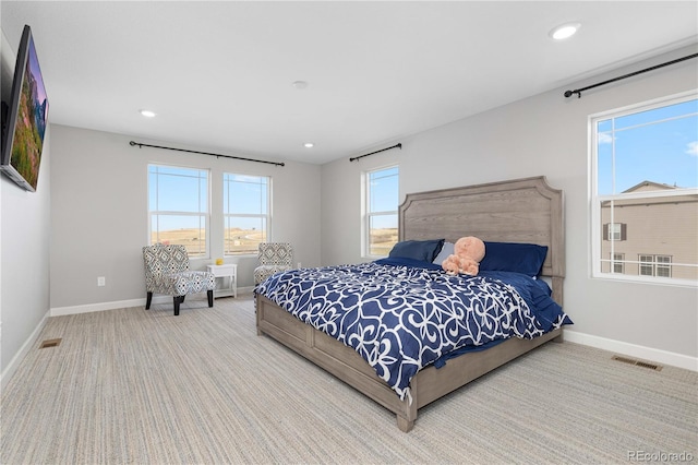 carpeted bedroom with visible vents, recessed lighting, and baseboards