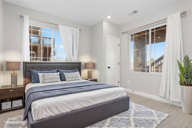 bedroom with visible vents, recessed lighting, baseboards, and light wood finished floors