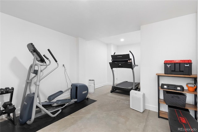 exercise area featuring recessed lighting and baseboards