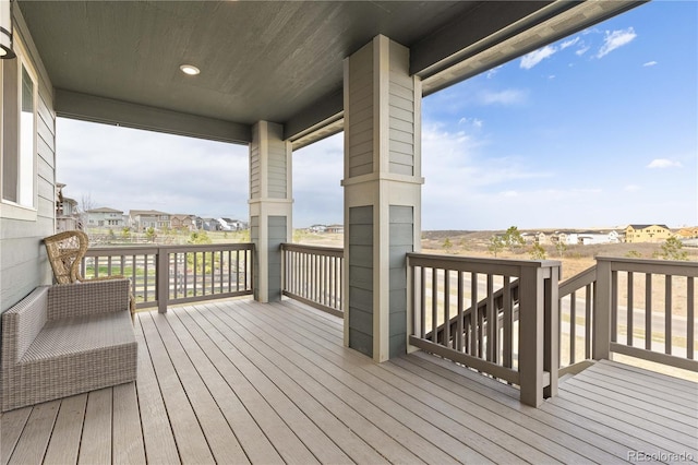 wooden terrace with a residential view