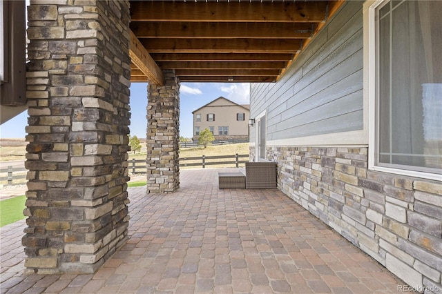 view of patio featuring fence