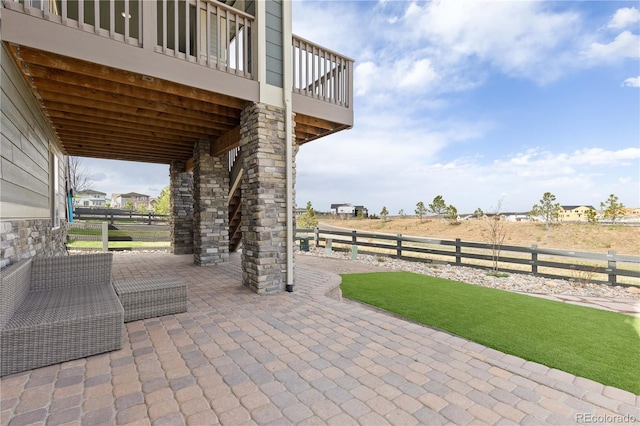 view of patio / terrace featuring fence
