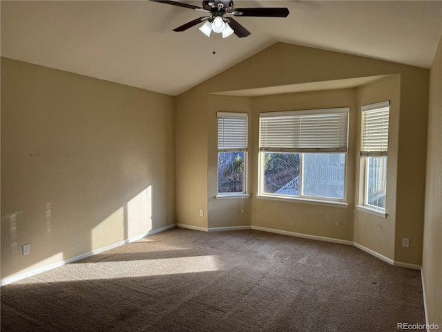 unfurnished room with light colored carpet, ceiling fan, and lofted ceiling