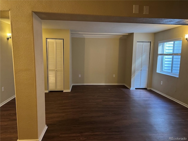 unfurnished room featuring dark hardwood / wood-style floors