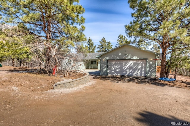 630 Rock Creek Mesa Rd, Colorado Springs, CO 80926 - ranch-style home featuring driveway and an attached garage