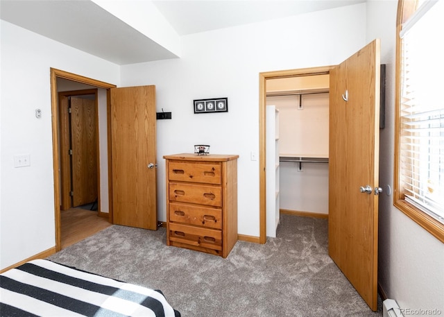630 Rock Creek Mesa Rd, Colorado Springs, CO 80926 - bedroom with a walk in closet, carpet flooring, baseboards, and a closet