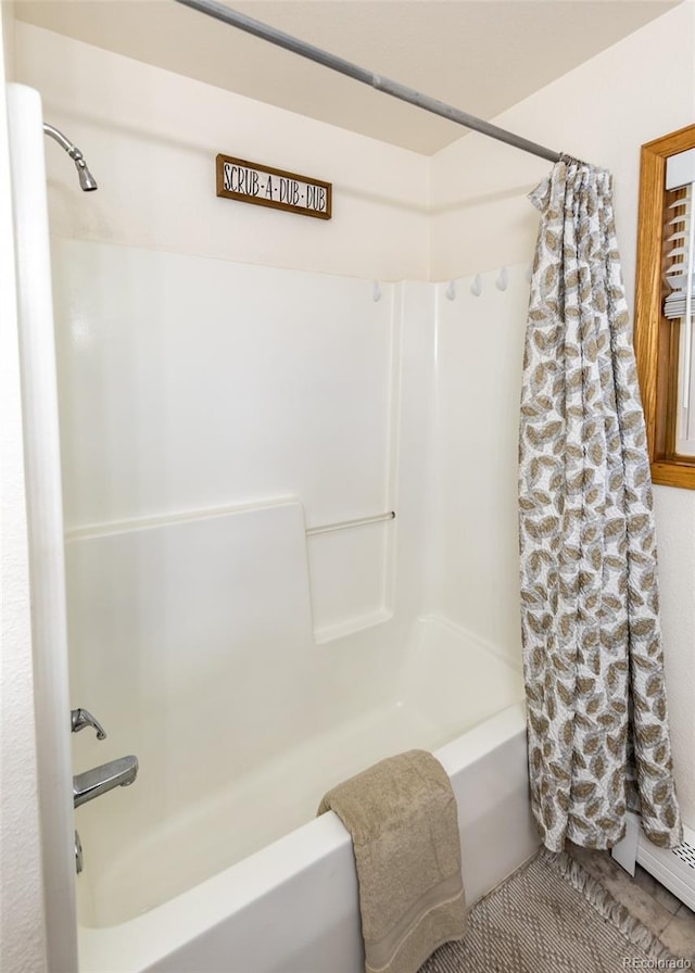 630 Rock Creek Mesa Rd, Colorado Springs, CO 80926 - bathroom featuring shower / bath combination with curtain and a baseboard radiator