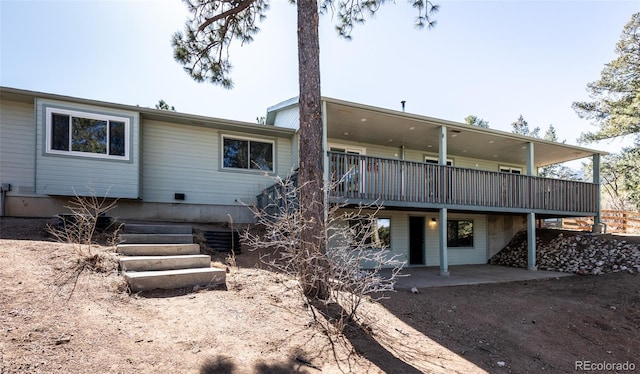 630 Rock Creek Mesa Rd, Colorado Springs, CO 80926 - back of house with a deck and a patio