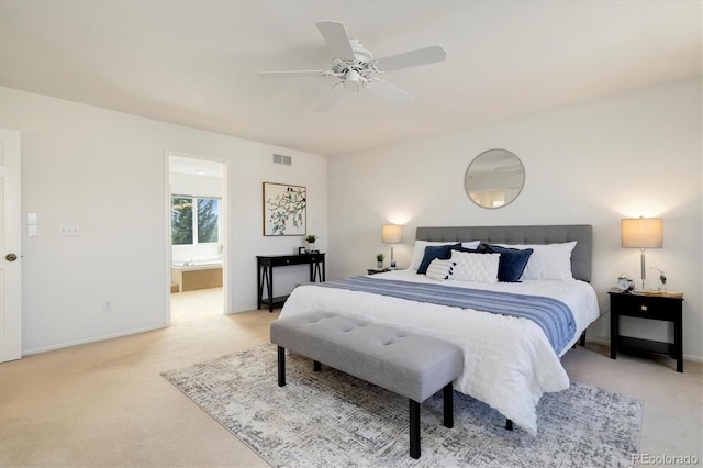 bedroom with light colored carpet, visible vents, connected bathroom, and ceiling fan