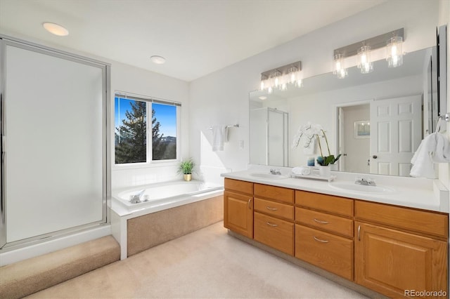 full bath featuring a bath, a shower stall, double vanity, and a sink