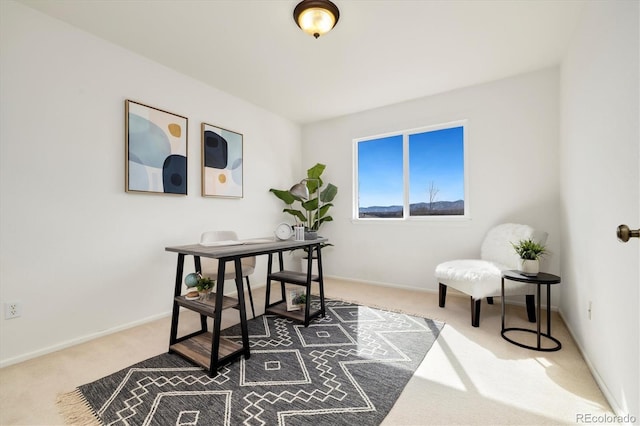 carpeted office featuring baseboards