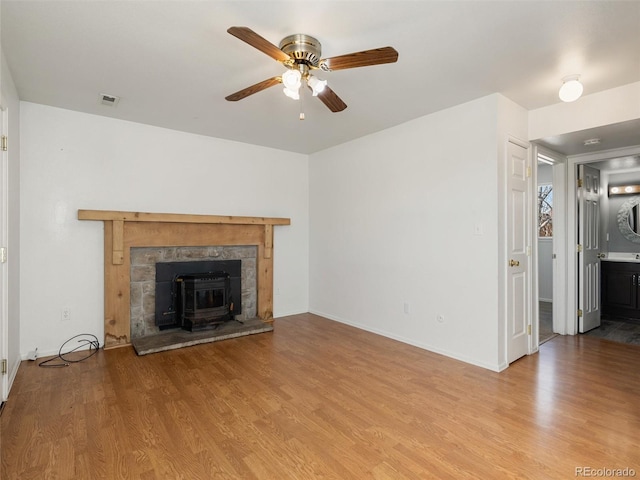 unfurnished living room with ceiling fan and light wood-type flooring