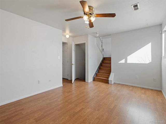 unfurnished room featuring ceiling fan and light wood-type flooring