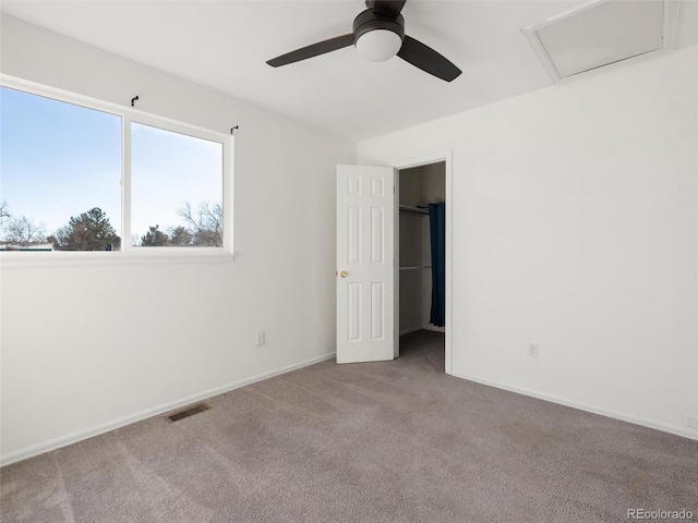 carpeted empty room with ceiling fan