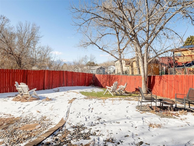 view of yard layered in snow