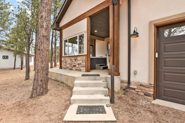 doorway to property featuring a porch