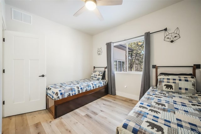 bedroom featuring light hardwood / wood-style flooring and ceiling fan