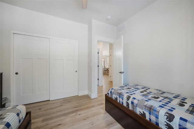 bedroom featuring a closet and light hardwood / wood-style flooring