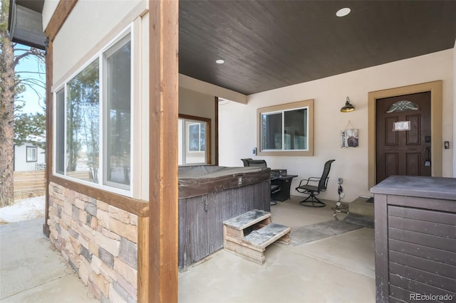 view of patio / terrace featuring a hot tub