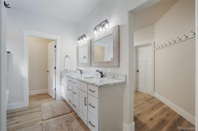 bathroom with vanity and hardwood / wood-style floors