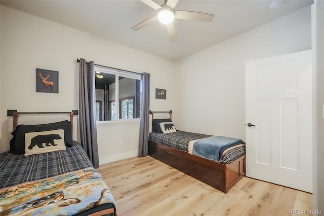 bedroom with ceiling fan and light hardwood / wood-style flooring