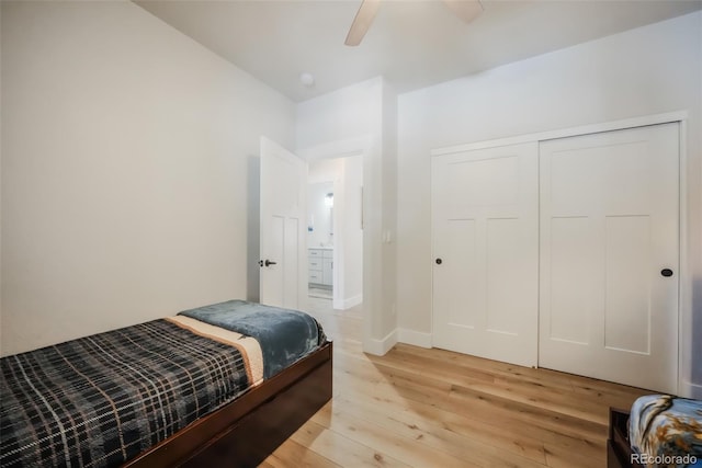 bedroom featuring ceiling fan, a closet, and light hardwood / wood-style flooring