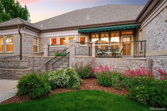 3231 Oak St, Wheat Ridge, CO 80033 - view of front facade featuring a shingled roof and stairs