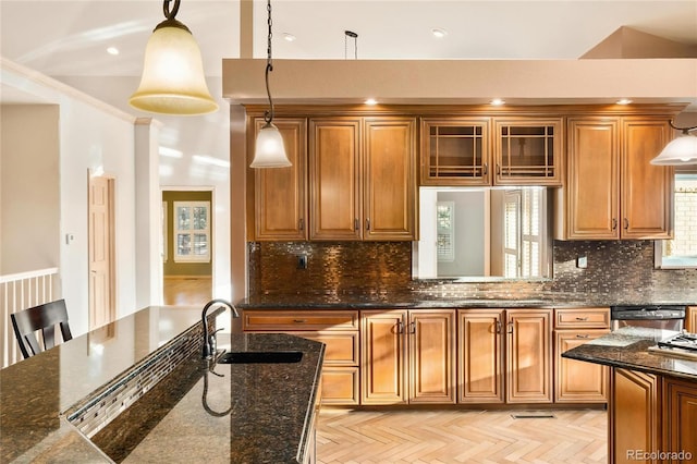 3231 Oak St, Wheat Ridge, CO 80033 - kitchen featuring brown cabinets, pendant lighting, glass insert cabinets, dark stone counters, and recessed lighting