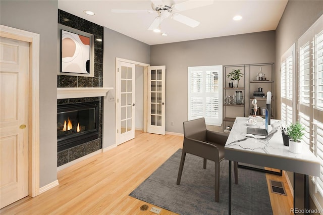 3231 Oak St, Wheat Ridge, CO 80033 - office space featuring french doors, wood finished floors, plenty of natural light, a high end fireplace, and recessed lighting