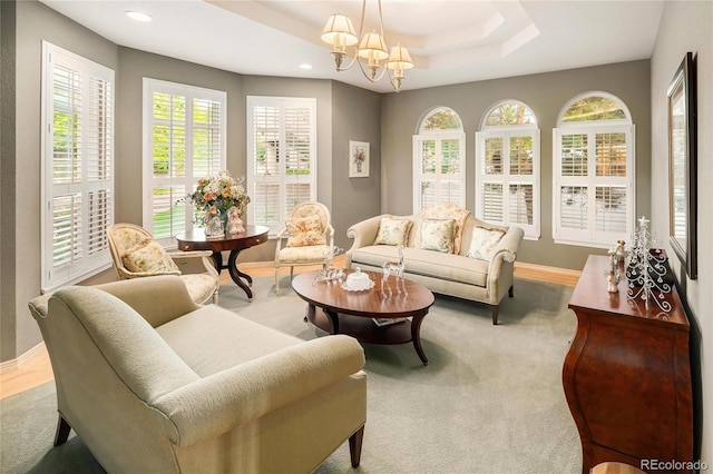 3231 Oak St, Wheat Ridge, CO 80033 - living area featuring a tray ceiling, recessed lighting, a chandelier, and carpet floors