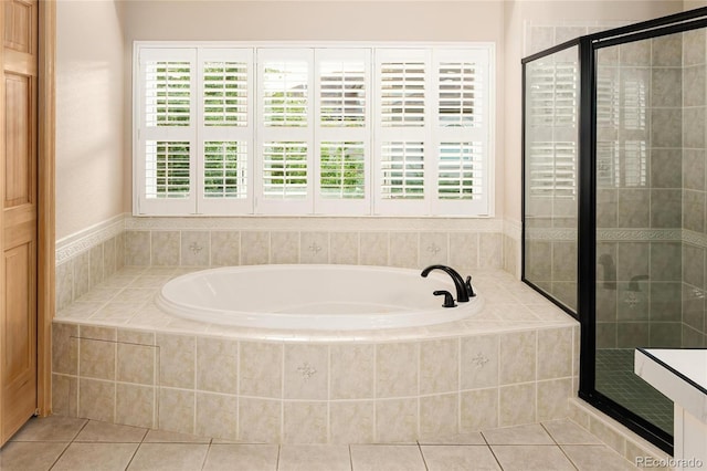3231 Oak St, Wheat Ridge, CO 80033 - full bathroom featuring a bath, a stall shower, and tile patterned floors