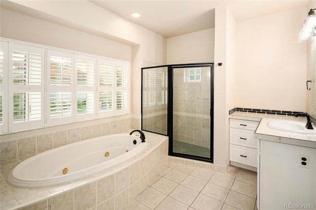 3231 Oak St, Wheat Ridge, CO 80033 - full bath featuring a jetted tub, a stall shower, tile patterned flooring, and vanity