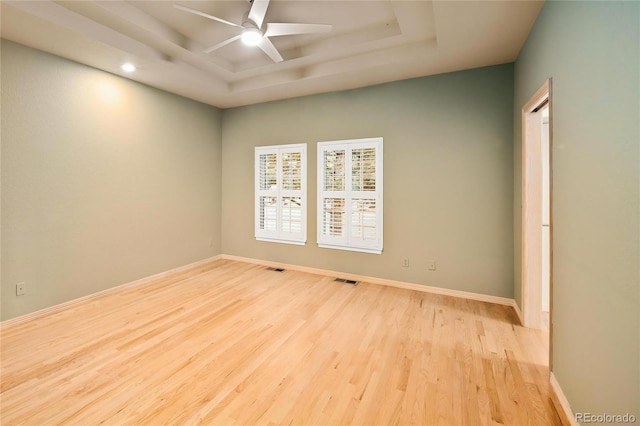 3231 Oak St, Wheat Ridge, CO 80033 - empty room with a tray ceiling, wood finished floors, a ceiling fan, and recessed lighting