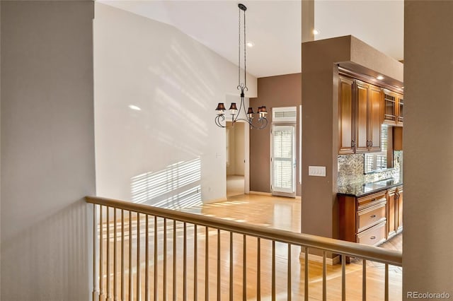 3231 Oak St, Wheat Ridge, CO 80033 - stairway with a chandelier, wood finished floors, and recessed lighting